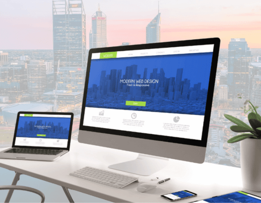 Modern responsive website design shown on desktop and laptop with Perth skyline, created by JimmyTech.